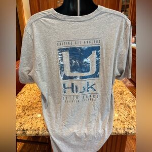 Huk men’s Outer Banks Angler t-shirt. Sharp blue print w/logos front/back/sleeve